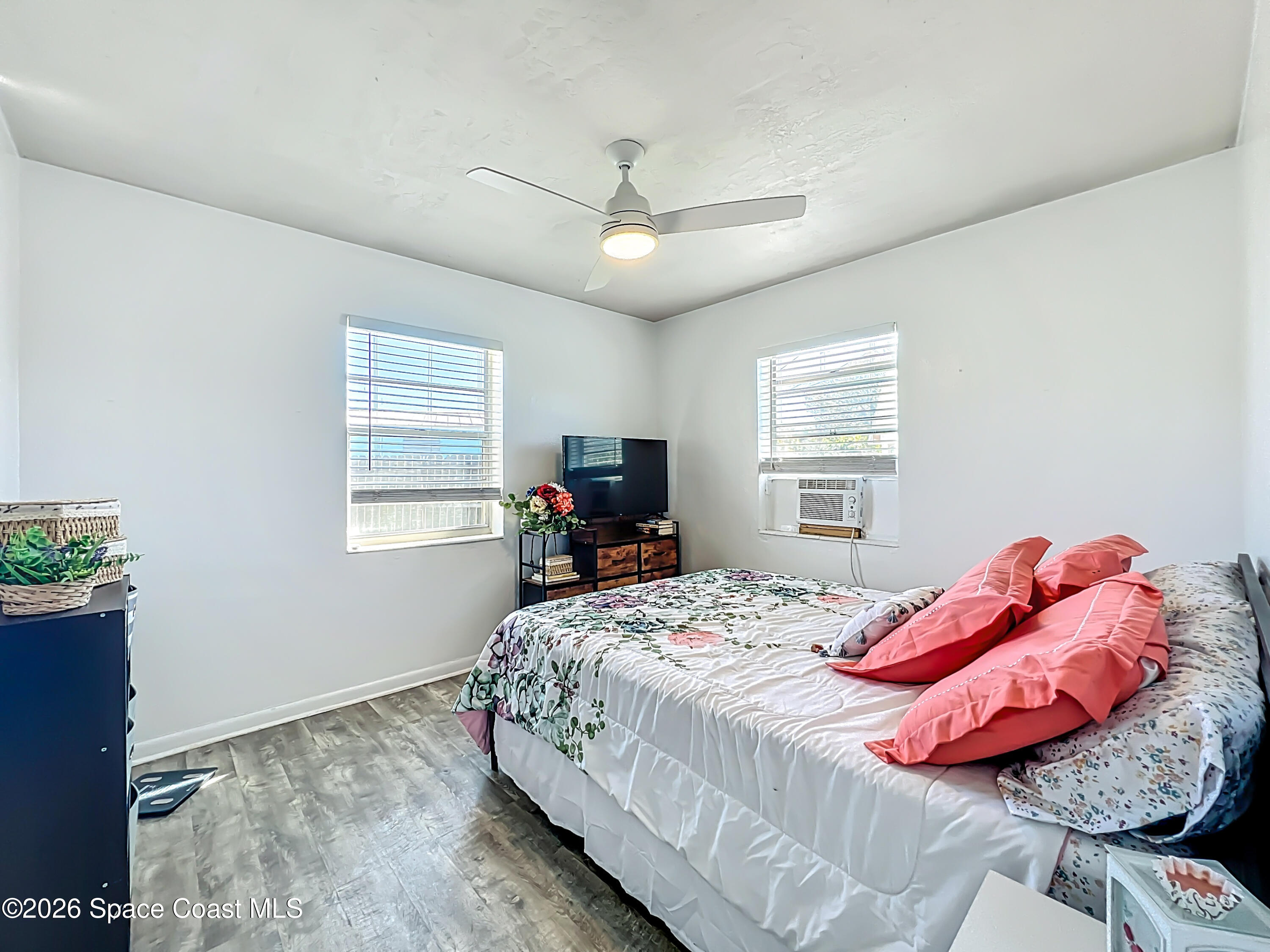 1090 Bianca Drive Northeast Palm Bay, FL 32905 - Photo 16 of 30 a bedroom with a bed and a window
