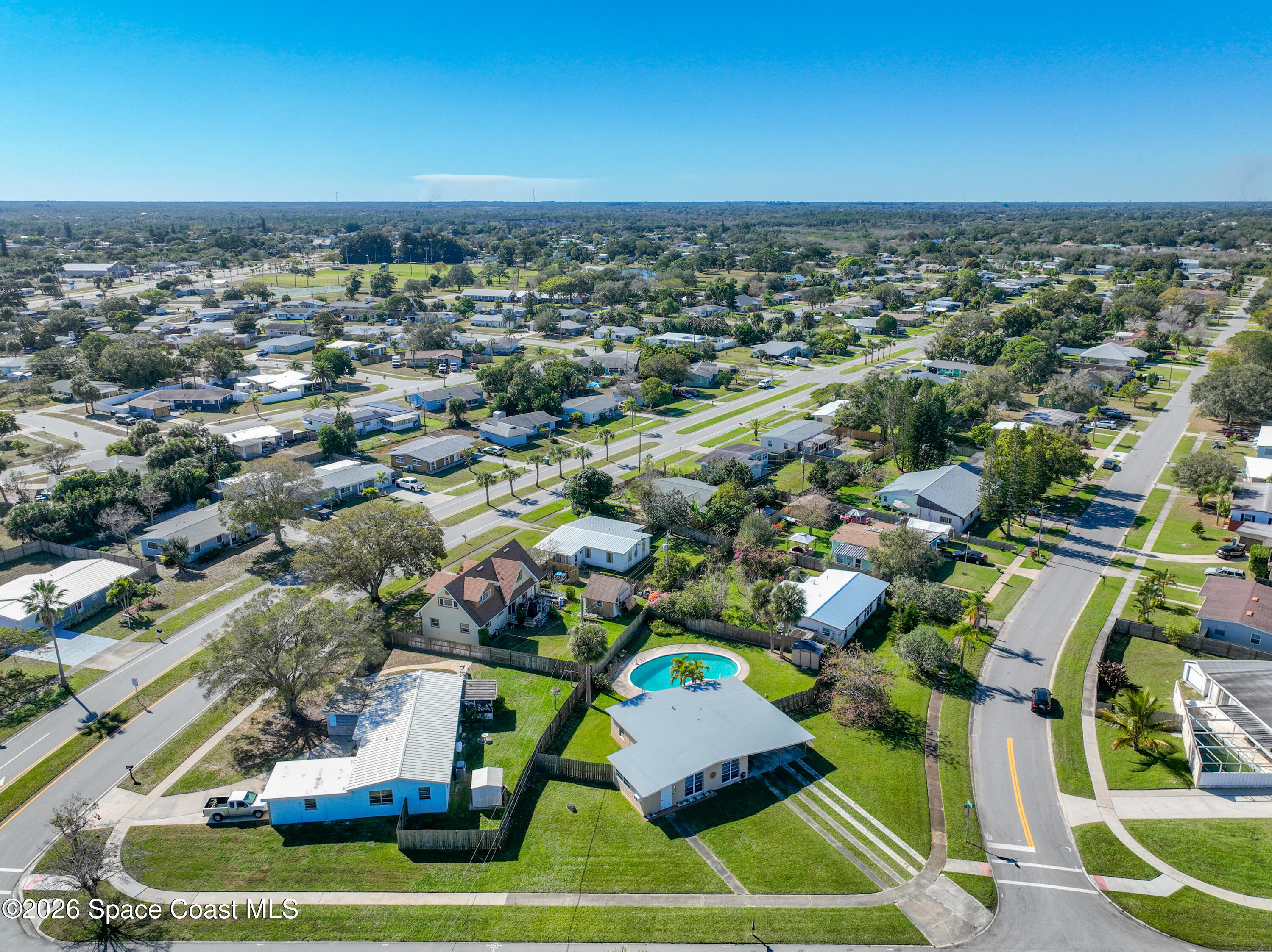 1090 Bianca Drive Northeast Palm Bay, FL 32905 - Photo 2 of 30 an aerial view of a house with a swimming pool