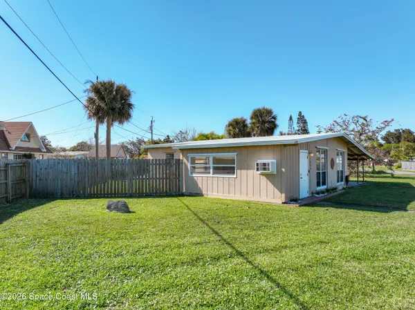 a view of a yard in front of a house with a yard