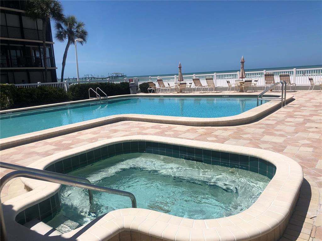 17580 Gulf Boulevard, Unit 206 Redington Shores, FL 33708 - Photo 10 of 11 a view of swimming pool from window