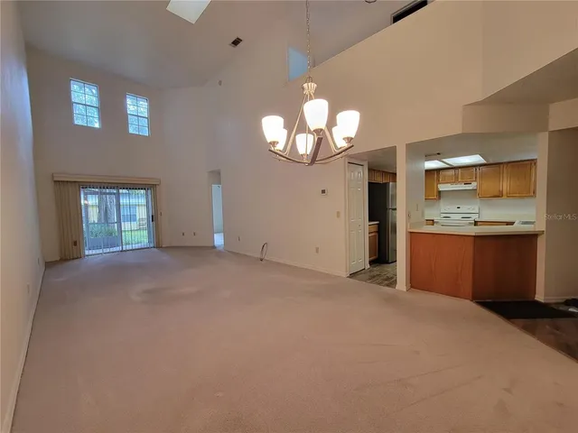 a view of a kitchen with a sink cabinets and a large window