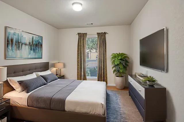 an empty room with windows and entrance