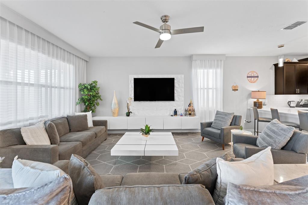 2933 Fable Street Kissimmee, FL 34746 - Photo 11 of 53 a living room with furniture and a flat screen tv