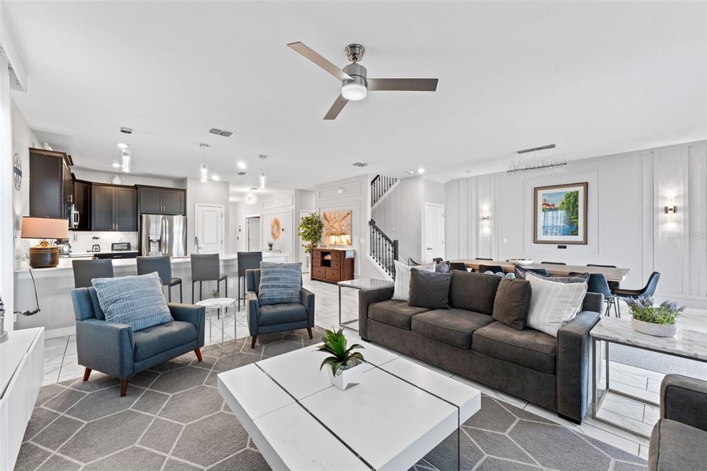2933 Fable Street Kissimmee, FL 34746 - Photo 13 of 53 a living room with furniture kitchen view and a wooden floor