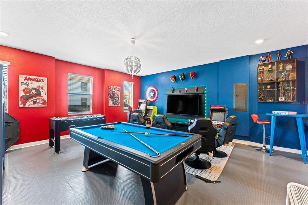 2933 Fable Street Kissimmee, FL 34746 - Photo 23 of 53 a living room with furniture pool table flat screen tv and windows