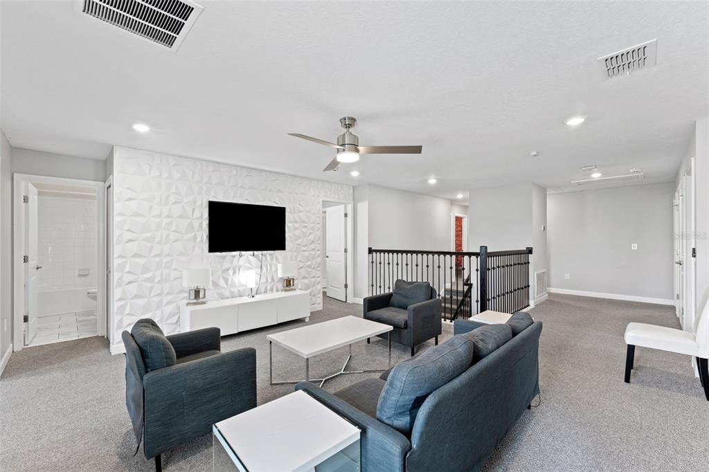 2933 Fable Street Kissimmee, FL 34746 - Photo 26 of 53 a living room with furniture and a flat screen tv