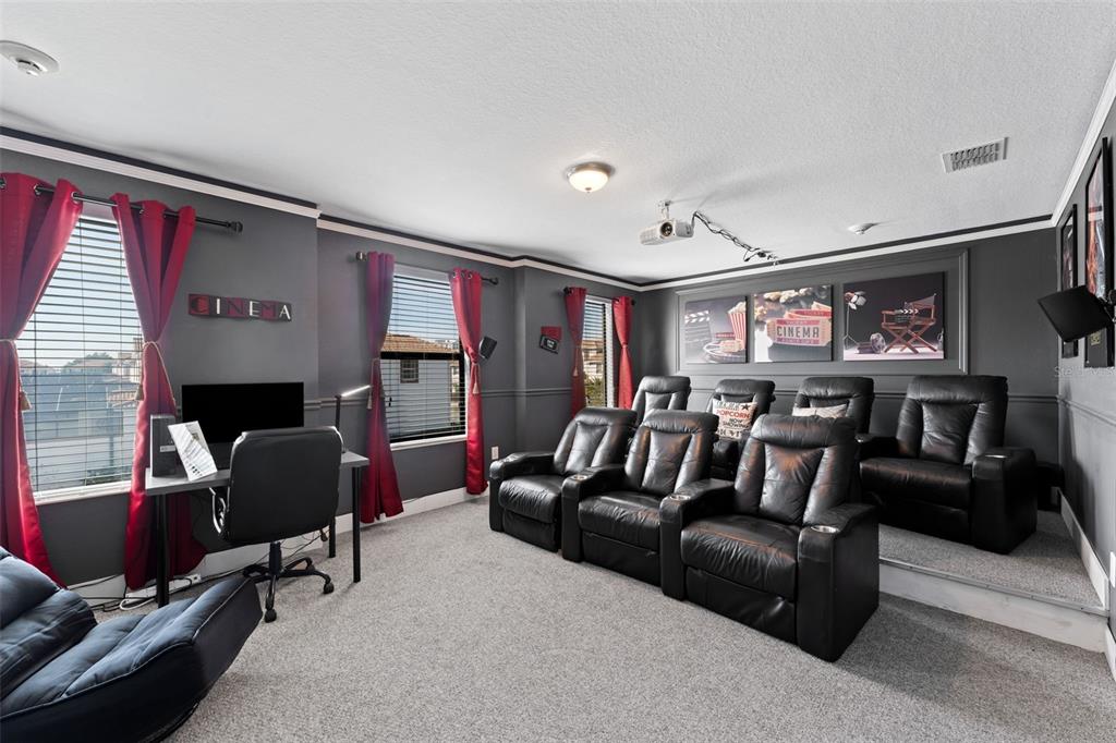 2933 Fable Street Kissimmee, FL 34746 - Photo 28 of 53 a living room with furniture and a flat screen tv