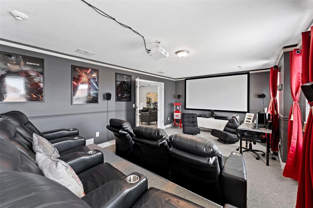 2933 Fable Street Kissimmee, FL 34746 - Photo 29 of 53 a living room with furniture and a flat screen tv