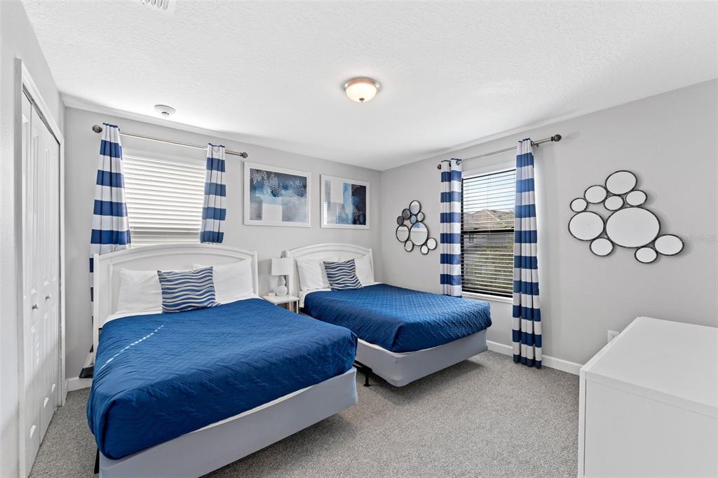 2933 Fable Street Kissimmee, FL 34746 - Photo 32 of 53 a bedroom with a bed and a bookshelf