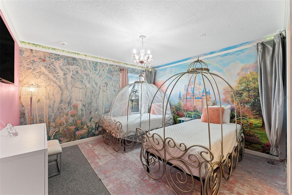 2933 Fable Street Kissimmee, FL 34746 - Photo 35 of 53 a bedroom with furniture and a chandelier