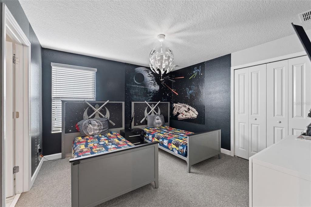 2933 Fable Street Kissimmee, FL 34746 - Photo 38 of 53 a room with furniture and a chandelier