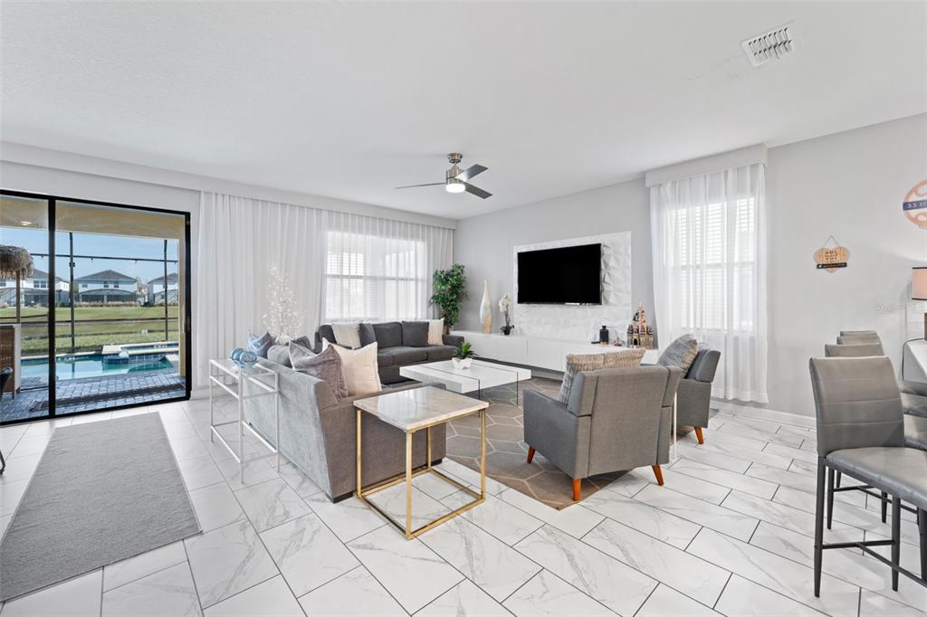 2933 Fable Street Kissimmee, FL 34746 - Photo 9 of 53 a living room with furniture and a flat screen tv