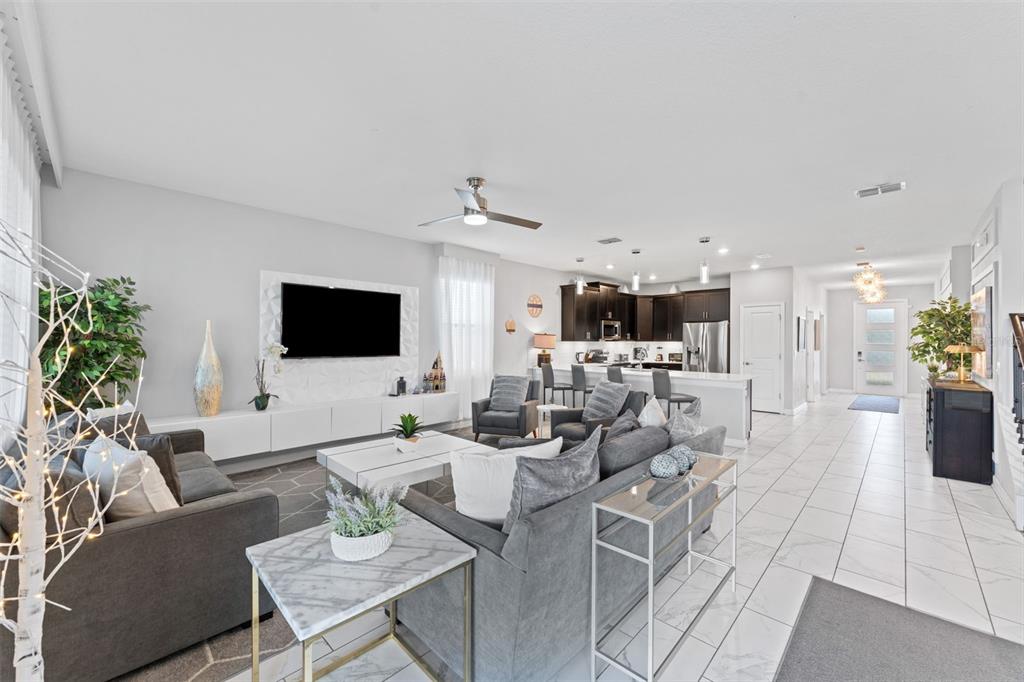 2933 Fable Street Kissimmee, FL 34746 - Photo 10 of 53 a living room with furniture and a flat screen tv