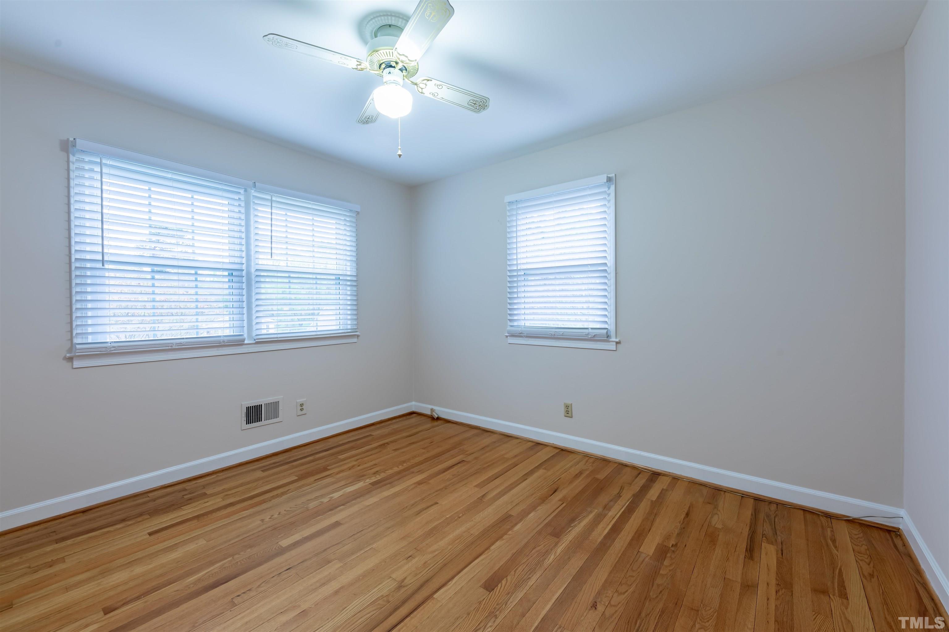 3101 Sherry Drive Raleigh, NC 27604 - Photo 16 of 28 a view of empty room with wooden floor and fan