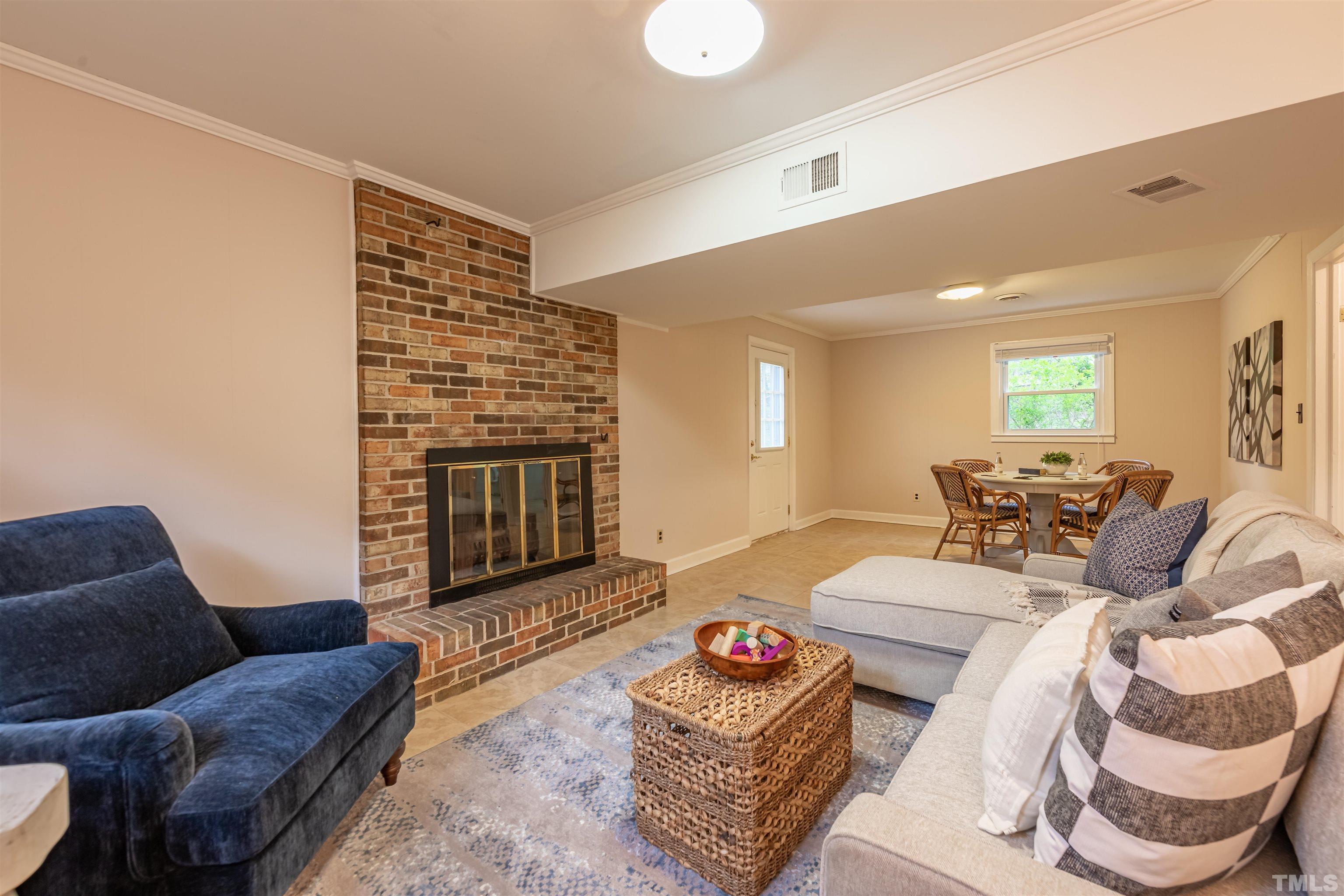 3101 Sherry Drive Raleigh, NC 27604 - Photo 20 of 28 a living room with furniture and a fireplace