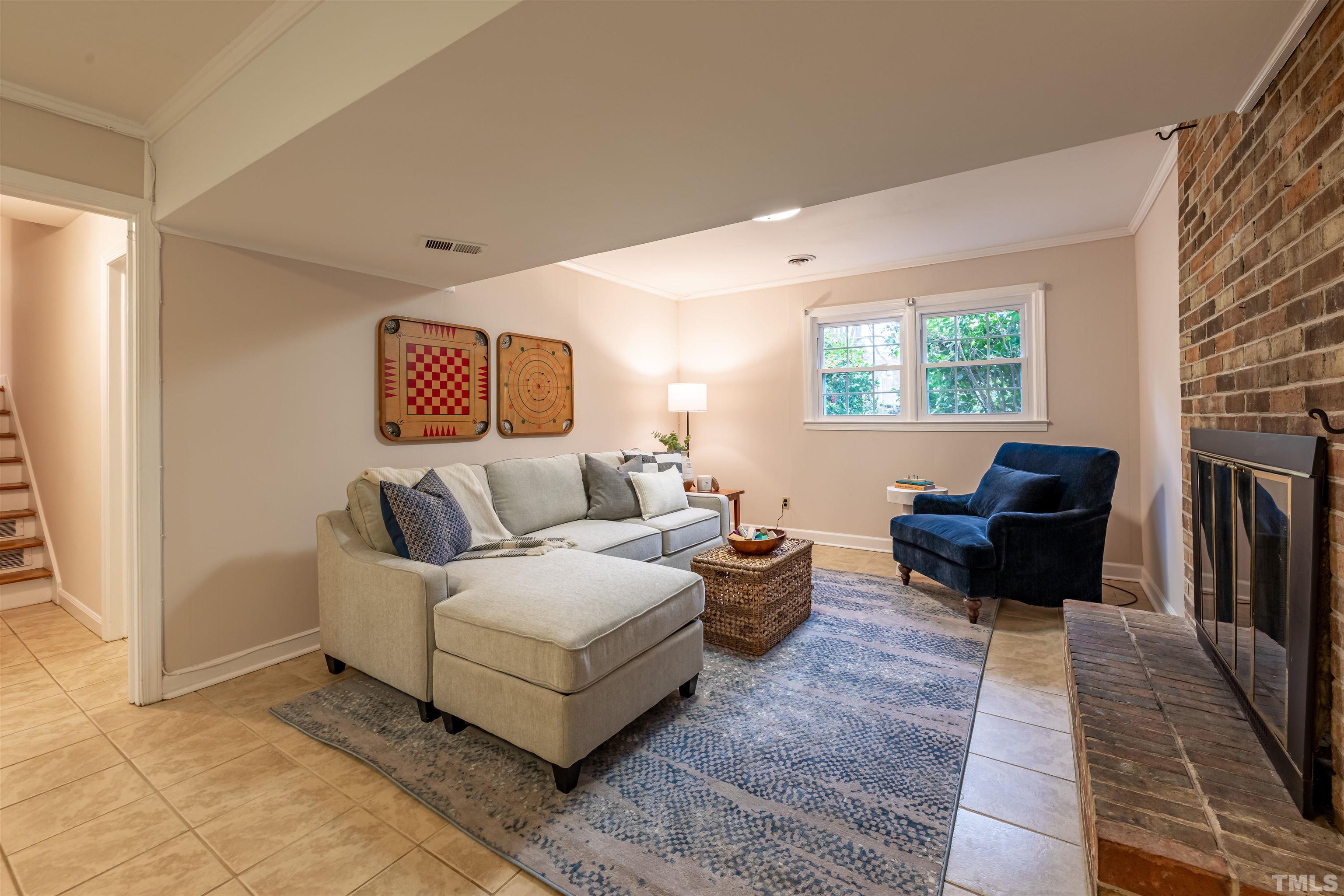 3101 Sherry Drive Raleigh, NC 27604 - Photo 21 of 28 a living room with furniture and a fireplace