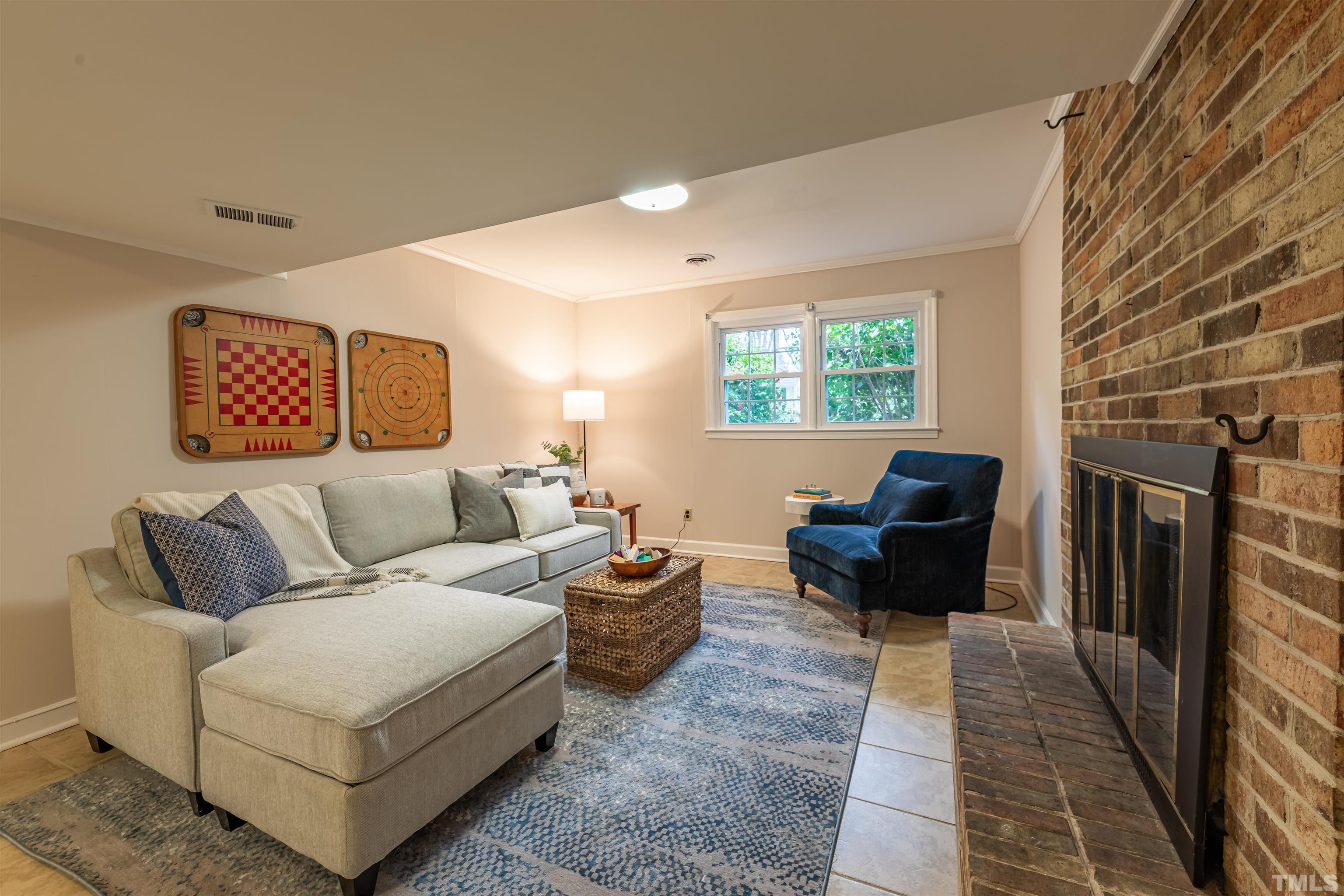 3101 Sherry Drive Raleigh, NC 27604 - Photo 24 of 28 a living room with furniture and a fireplace