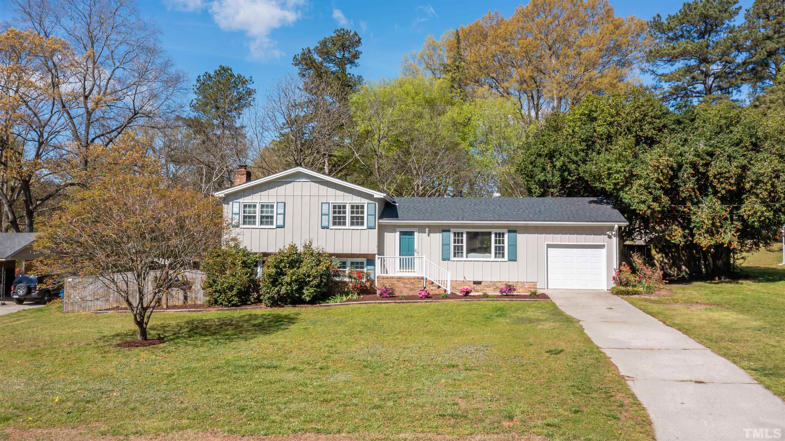 3101 Sherry Drive Raleigh, NC 27604 - Photo 28 of 28 a front view of house with yard and trees in the background