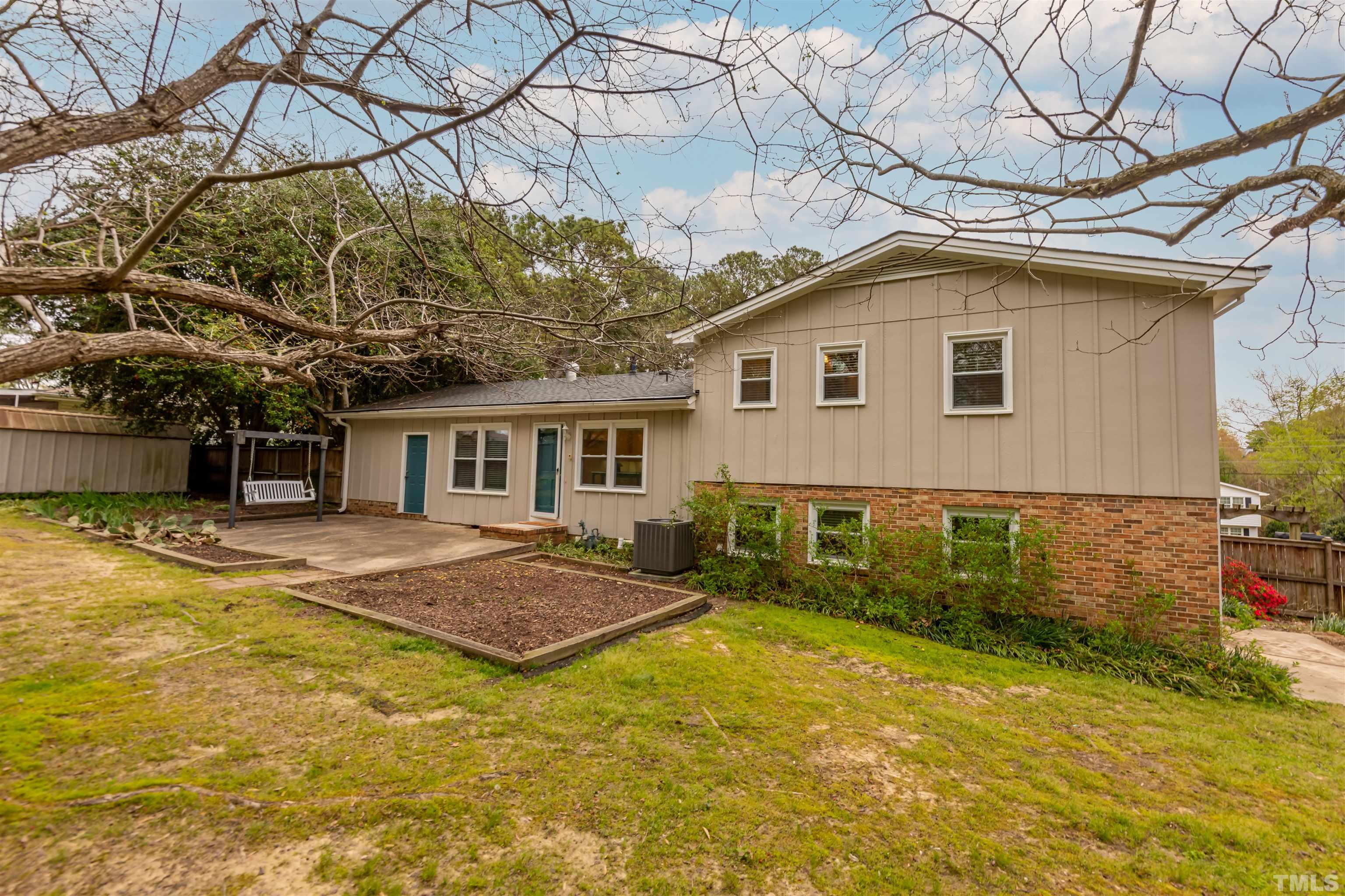3101 Sherry Drive Raleigh, NC 27604 - Photo 4 of 28 a front view of a house with a yard and garage