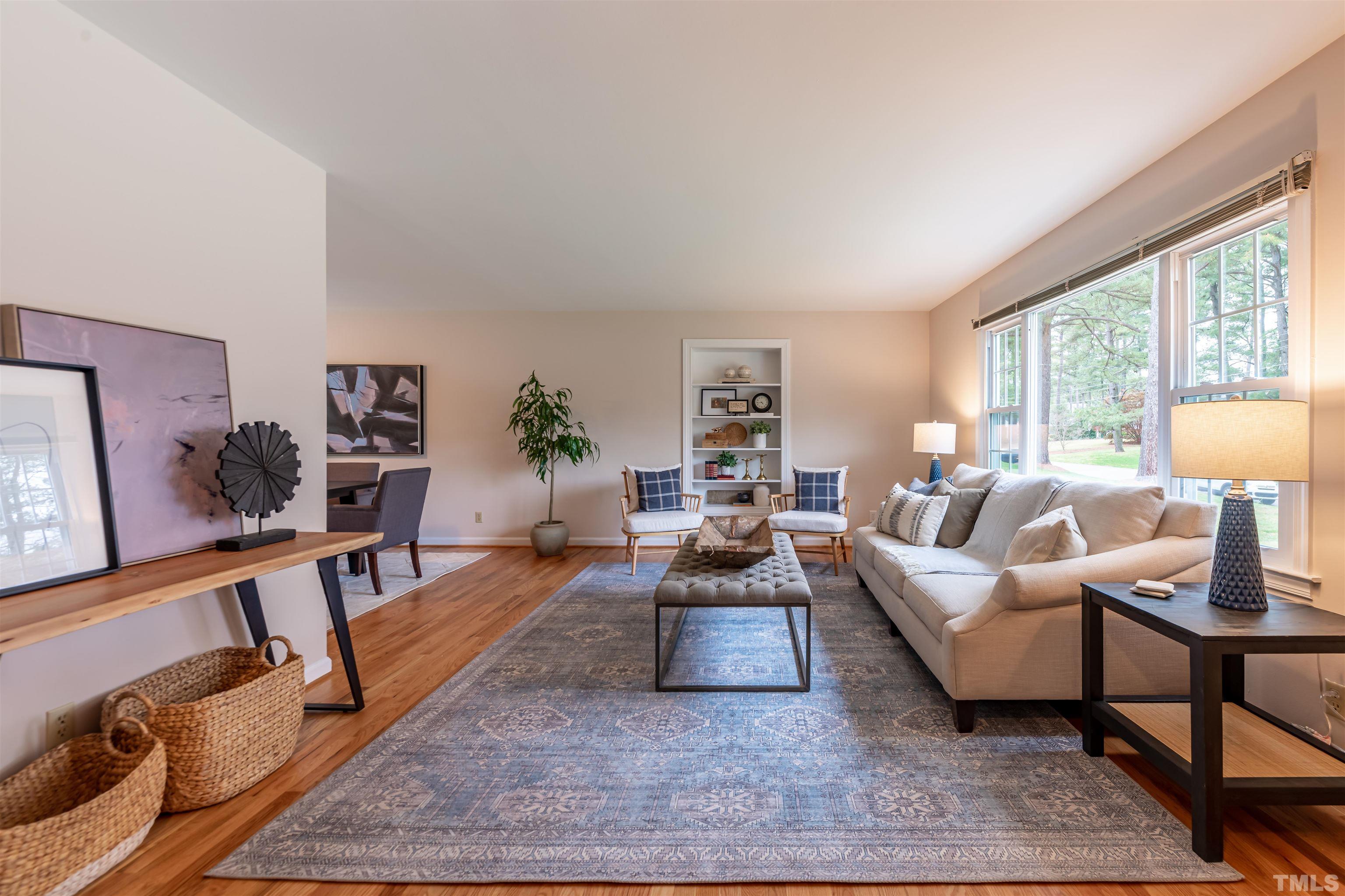 3101 Sherry Drive Raleigh, NC 27604 - Photo 8 of 28 a living room with furniture large window and a table