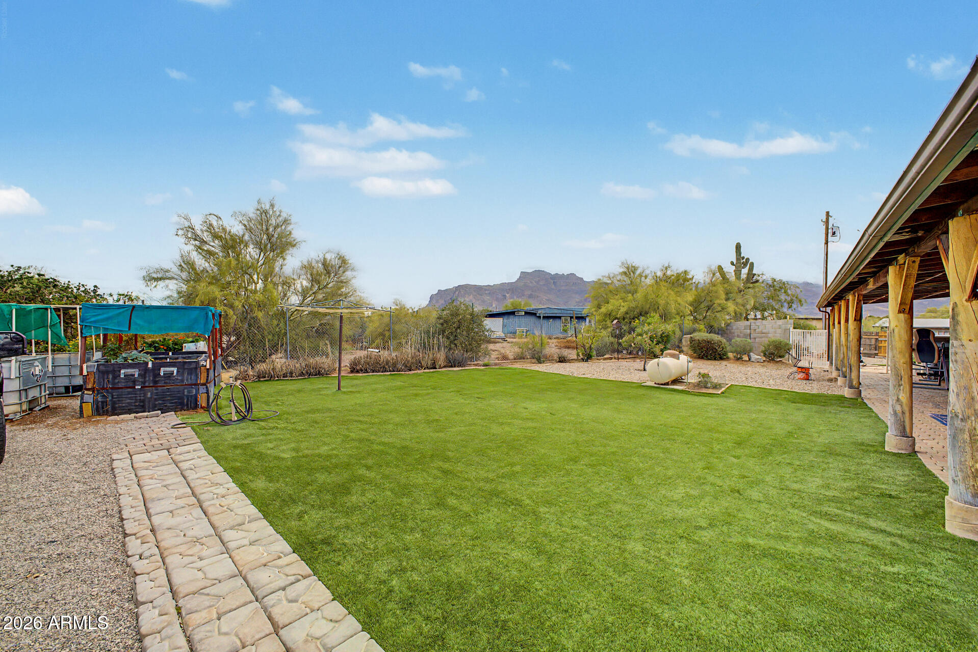 2548 South Val Vista Road Apache Junction, AZ 85119 - Photo 5 of 29 a backyard of a house with table and chairs