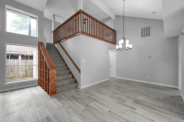 a view of an entryway with wooden floor