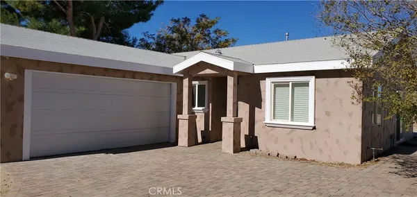 a front view of a house with a garage