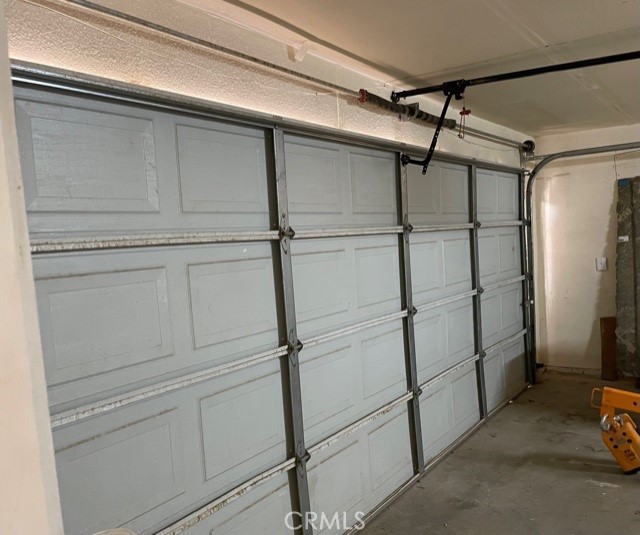 10645 East Ave R 12 Littlerock, CA 93543 - Photo 22 of 23 a view of a room with racks on the wall