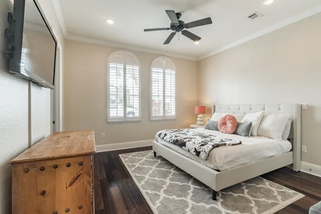 a bedroom with a large bed and a window