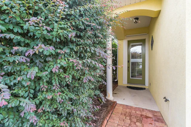 a view of a house with a small yard