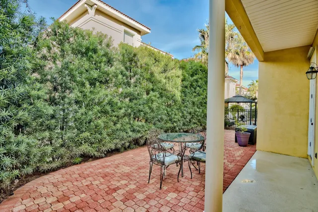 a backyard of a house with yard and outdoor seating