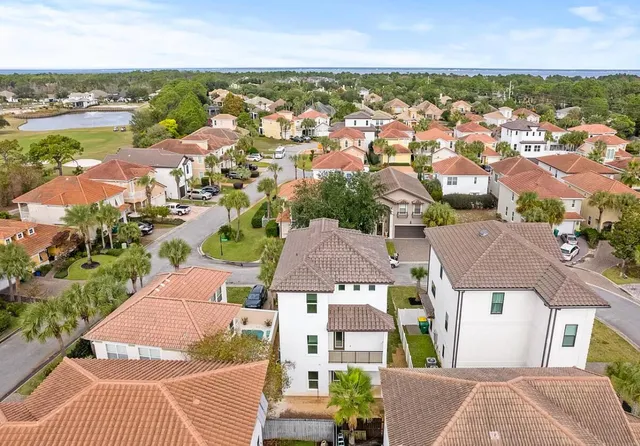 an aerial view of residential houses with outdoor space