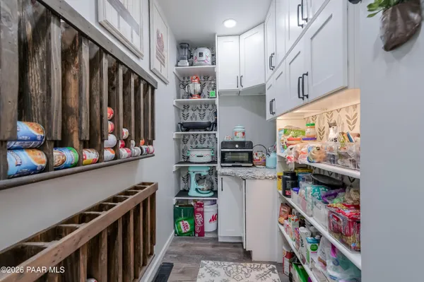 a bathroom with a double vanity sink mirror and shower