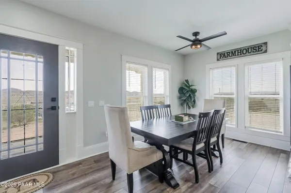 a bedroom with furniture and a wooden floor