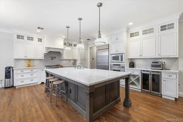 a kitchen with a stove a sink and a refrigerator