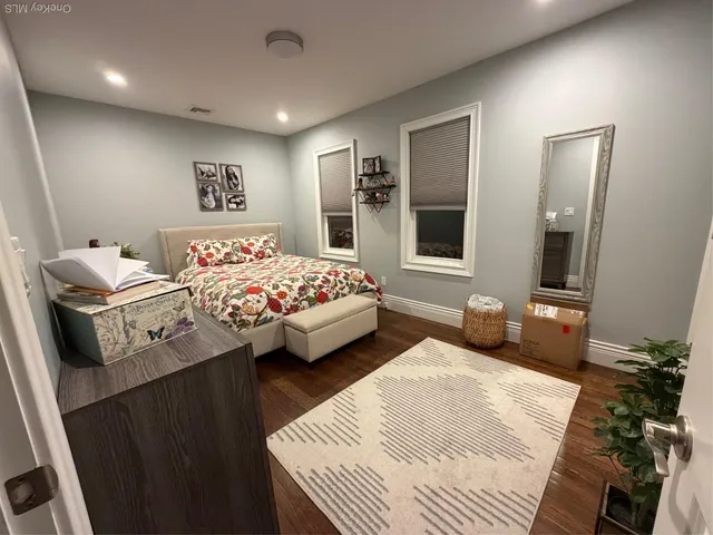 a bedroom with bed and window