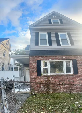a front view of a house with yard