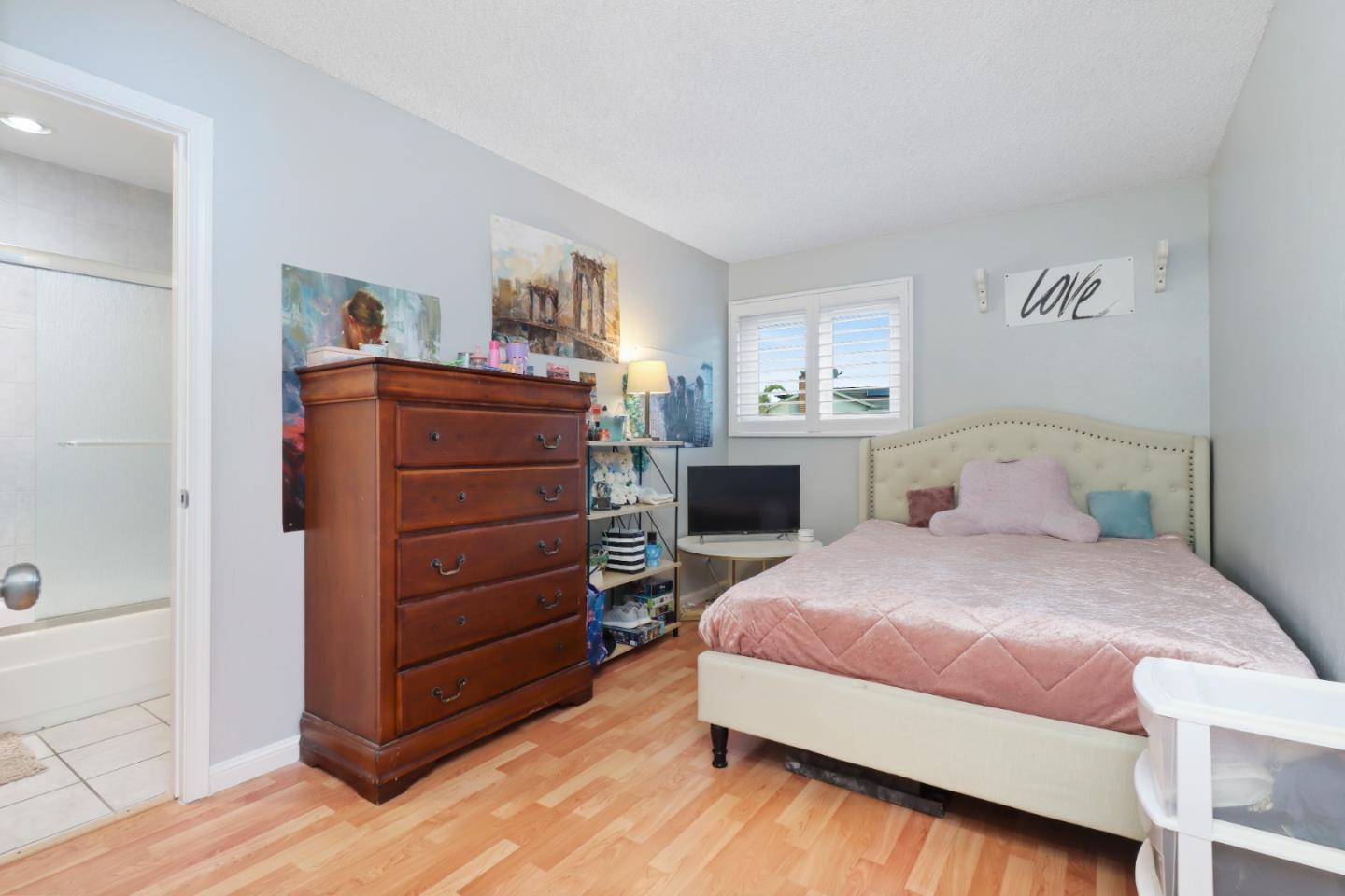 3784 Timberline Drive San Jose, CA 95121 - Photo 14 of 17 a bedroom with a bed and a dresser