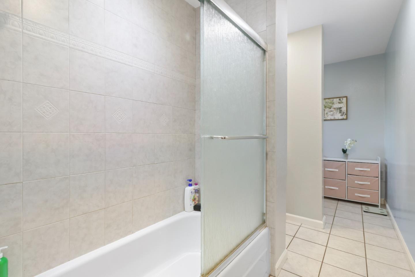 3784 Timberline Drive San Jose, CA 95121 - Photo 15 of 17 a bathroom with a bathtub and a shower