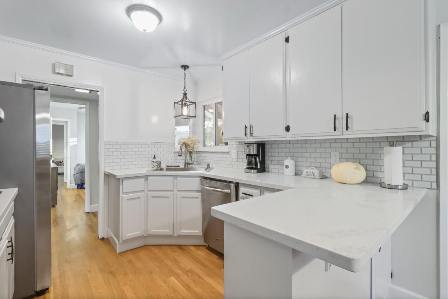 3784 Timberline Drive San Jose, CA 95121 - Photo 3 of 17 a kitchen with sink a stove and cabinets