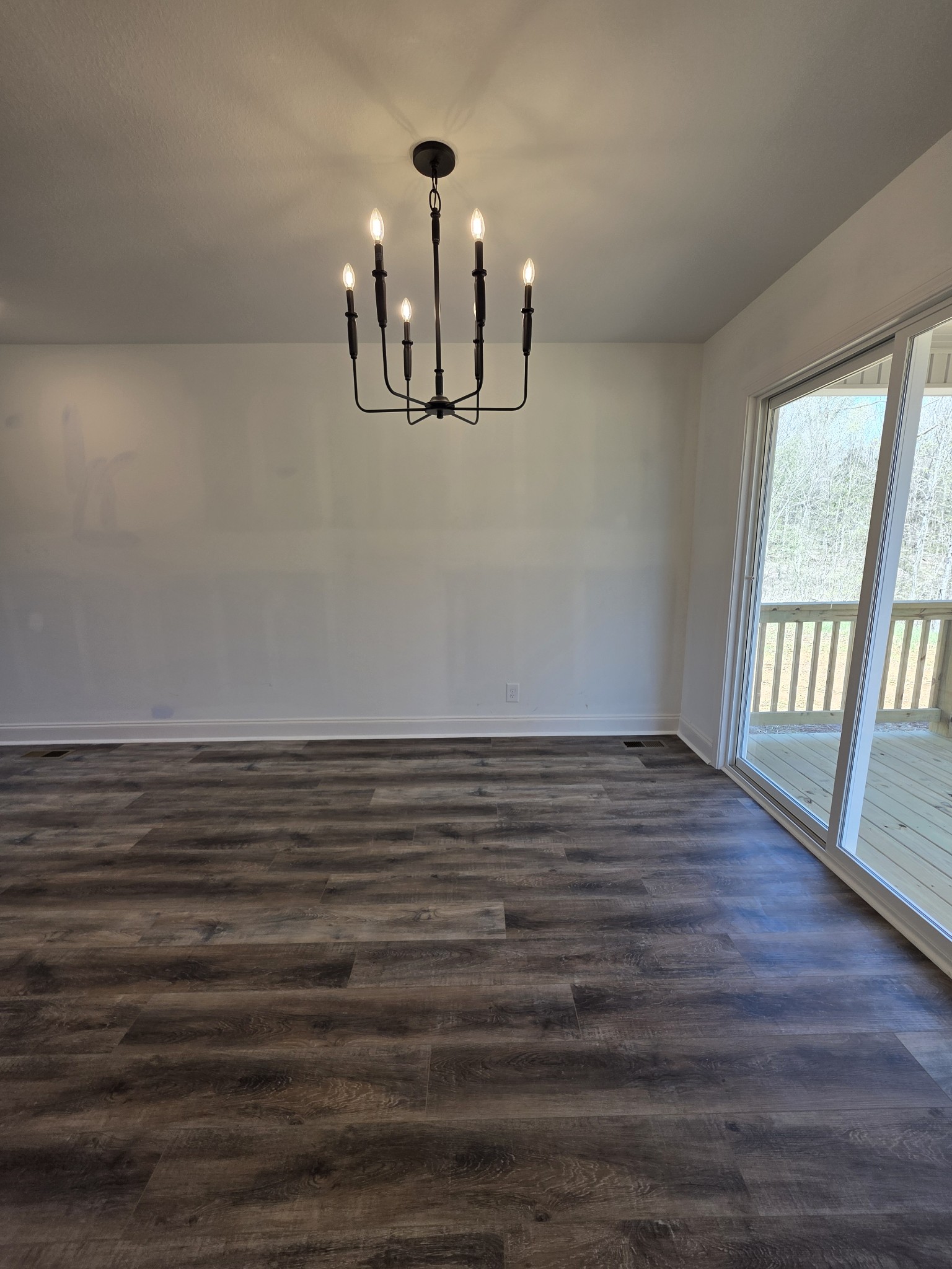 475 Ridge Top Court Clarksville, TN 37040 - Photo 10 of 44 a view of an empty room with window and wooden floor