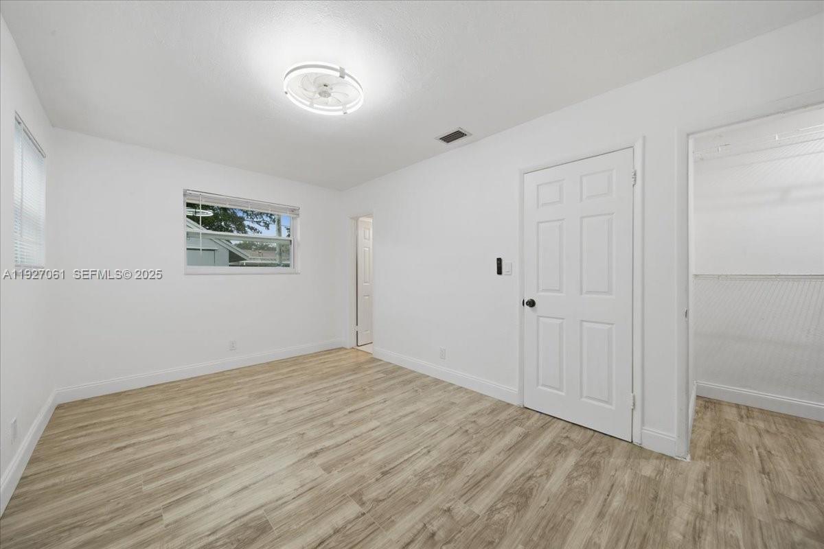 3330 North 72nd Terrace Hollywood, FL 33024 - Photo 17 of 32 a view of an empty room and wooden floor