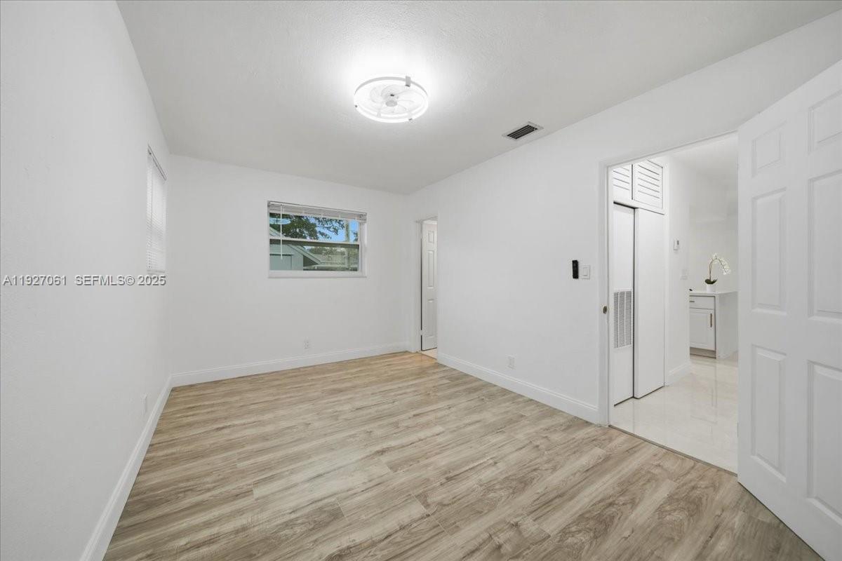 3330 North 72nd Terrace Hollywood, FL 33024 - Photo 18 of 32 a view of room with window and ceiling fan