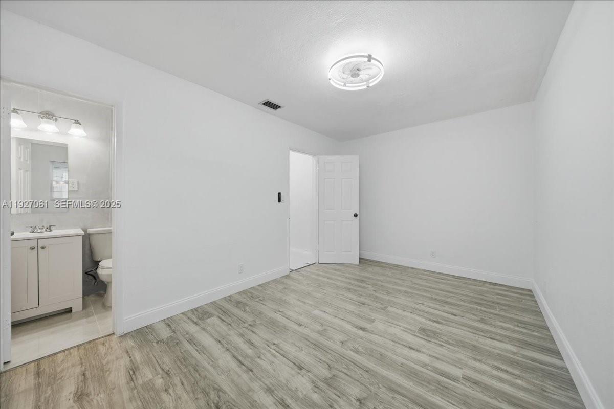 3330 North 72nd Terrace Hollywood, FL 33024 - Photo 19 of 32 a view of an empty room and window