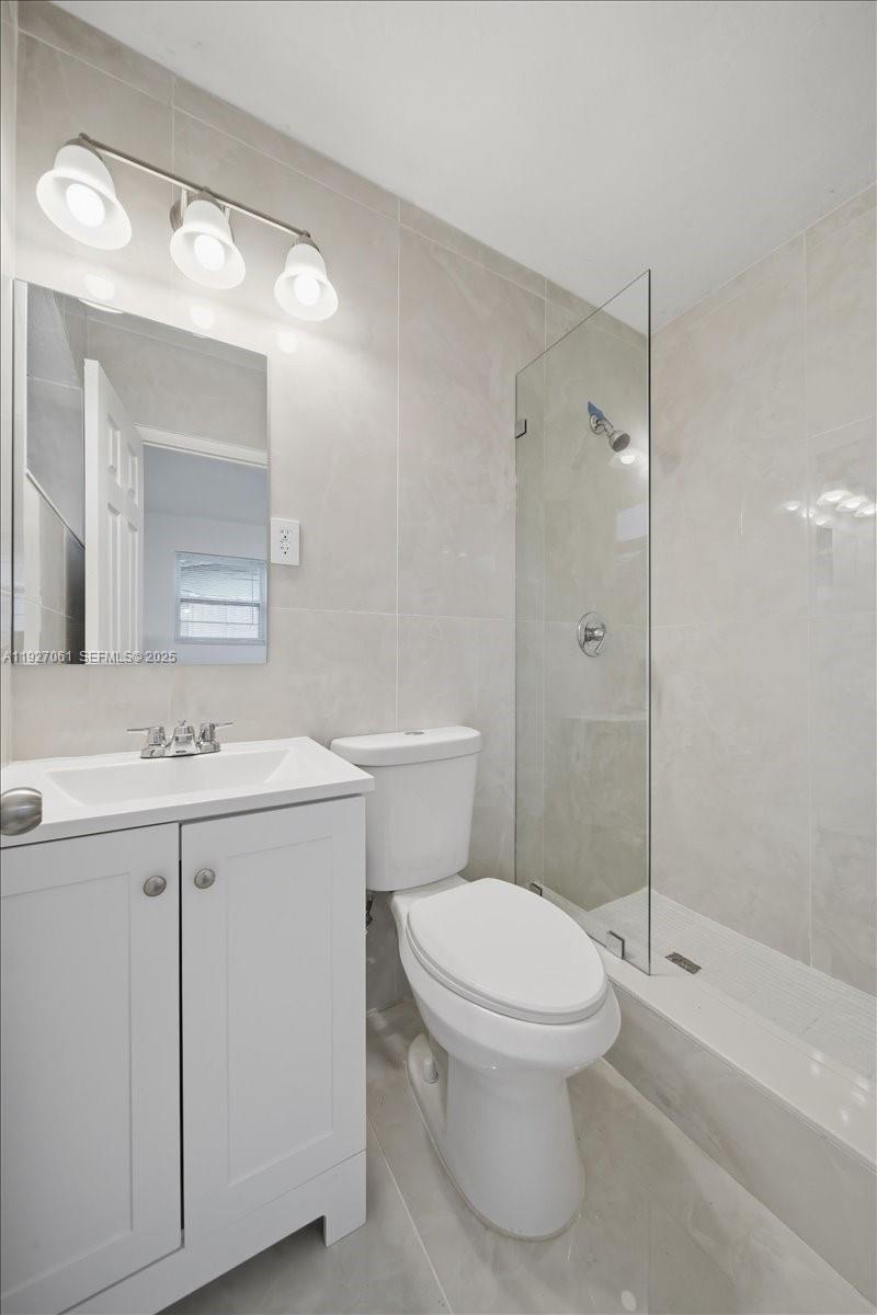 3330 North 72nd Terrace Hollywood, FL 33024 - Photo 20 of 32 a bathroom with a sink a toilet and shower