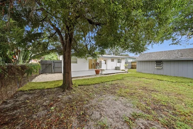 a house with trees in the background