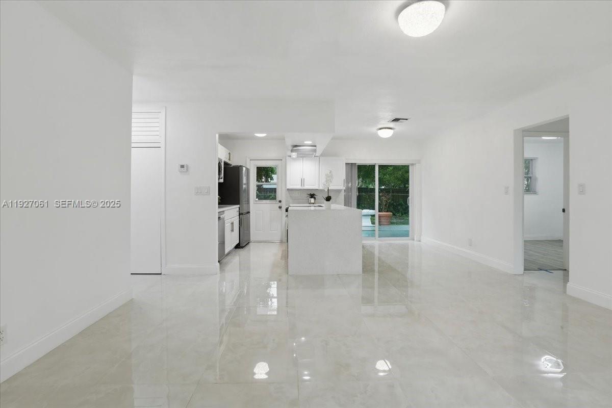 3330 North 72nd Terrace Hollywood, FL 33024 - Photo 10 of 32 a view of a kitchen with refrigerator and windows