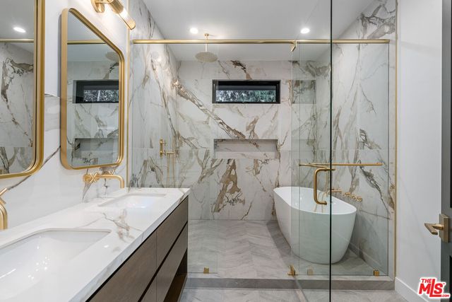 a bathroom with a bathtub and a sink