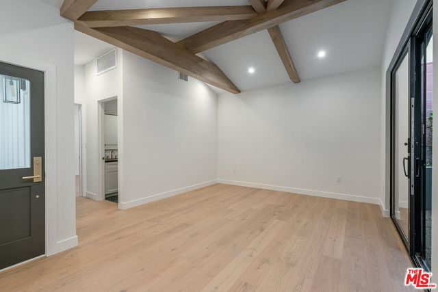a kitchen with granite countertop a stove and a sink