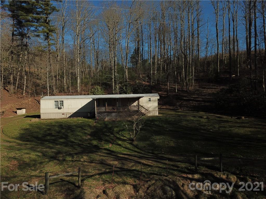 326 Indian Springs Road Clyde, NC 28721 - Photo 3 of 19 a backyard of a house